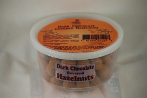 Dark_chocolate_covered_hazelnuts_mini_tub-large